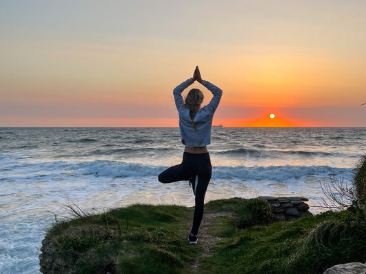 Person practicing mindfulness and yoga for mental health and burnout recovery
